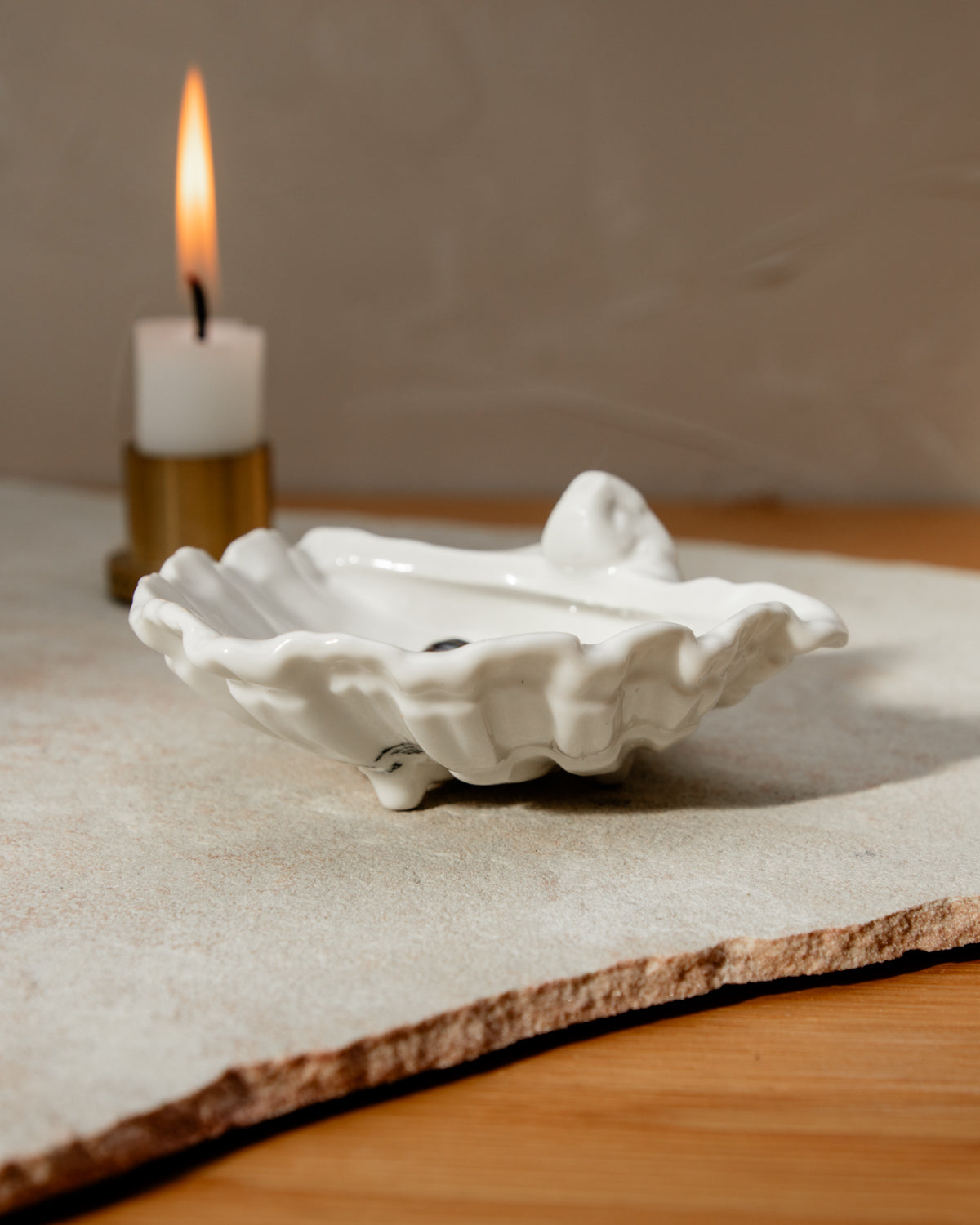 Oyster on coffee table with candle