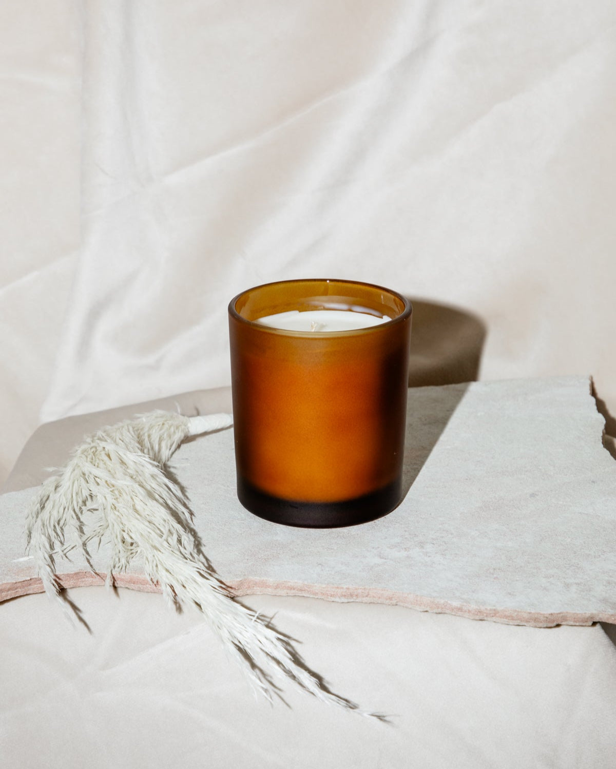 Orange Candle on Cloth