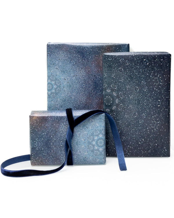 Galaxy gift wrap with blue ribbon on white background
