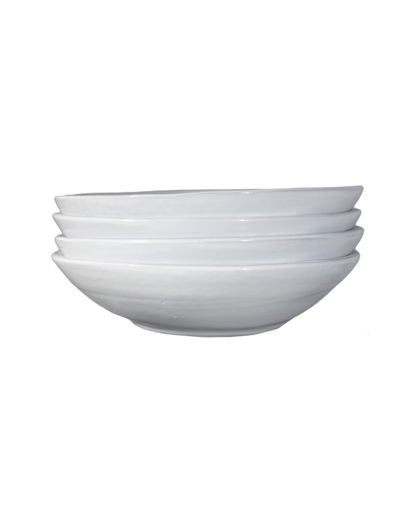 Stack of white ceramic bowls on a white background